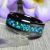 Black Ceramic Wedding Ring with Antimonite Crystals & Ocean Blue Opal